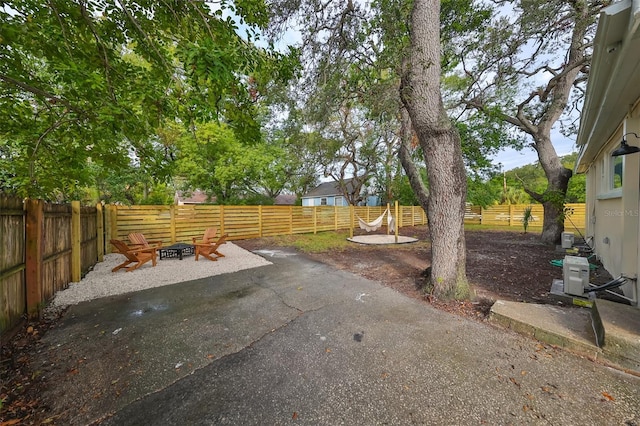 view of yard with a patio and a fire pit