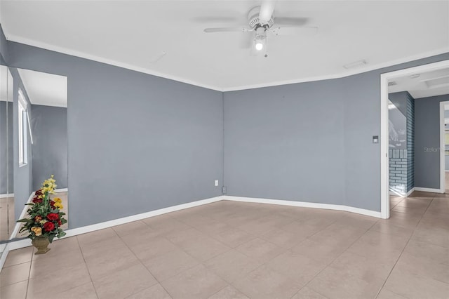 empty room with ceiling fan, light tile patterned floors, and crown molding