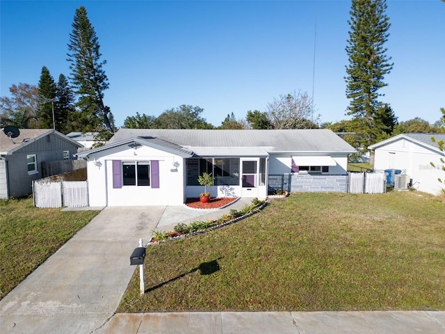 view of front of property featuring a front yard and central air condition unit