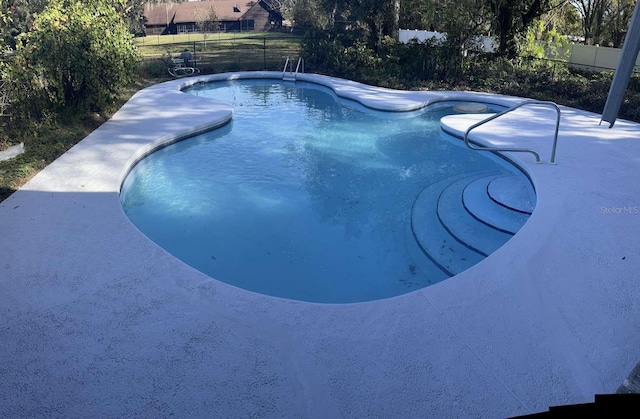 view of pool featuring a patio