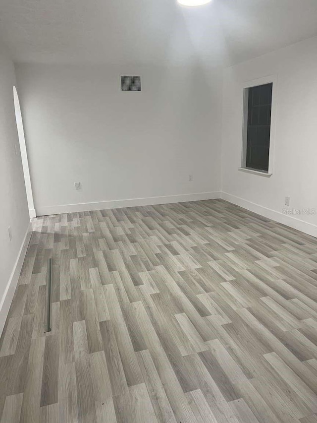 spare room with light hardwood / wood-style floors