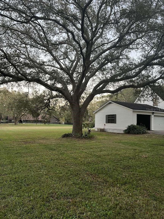 view of yard with a garage