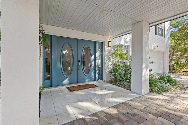 doorway to property featuring a garage