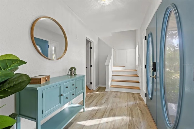 foyer entrance with light wood-type flooring