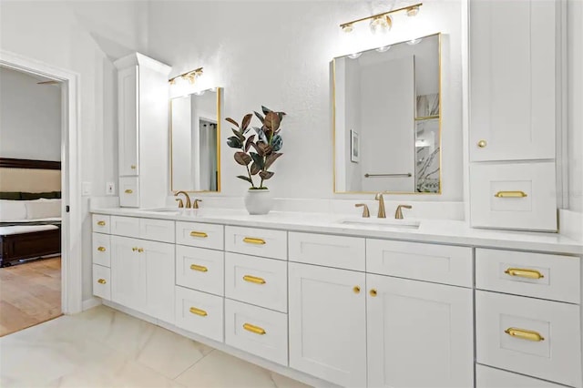 bathroom with hardwood / wood-style flooring and vanity