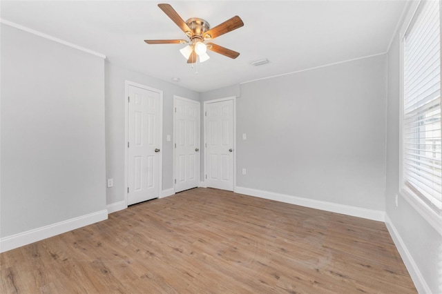 unfurnished room featuring ceiling fan and light wood-type flooring