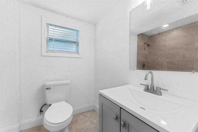 bathroom with tile patterned floors, vanity, and toilet