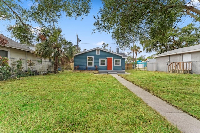 view of front of home with a front lawn