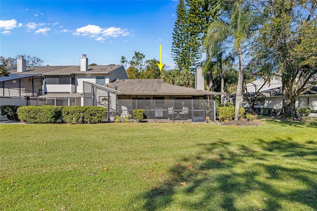 view of yard with a sunroom