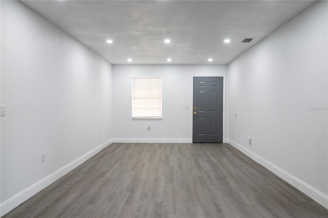 empty room featuring wood-type flooring