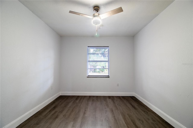 spare room with ceiling fan and dark hardwood / wood-style floors