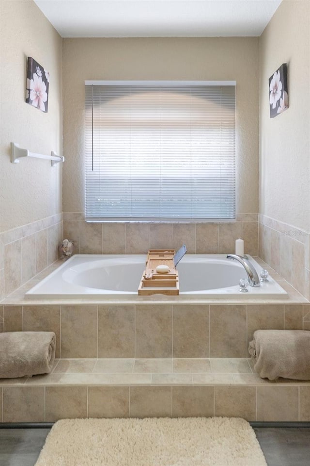 bathroom with tiled tub