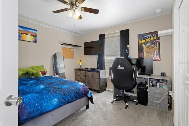 bedroom featuring ceiling fan and light colored carpet