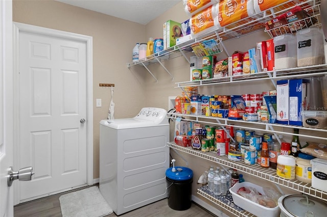 laundry room featuring washer / dryer and hardwood / wood-style flooring