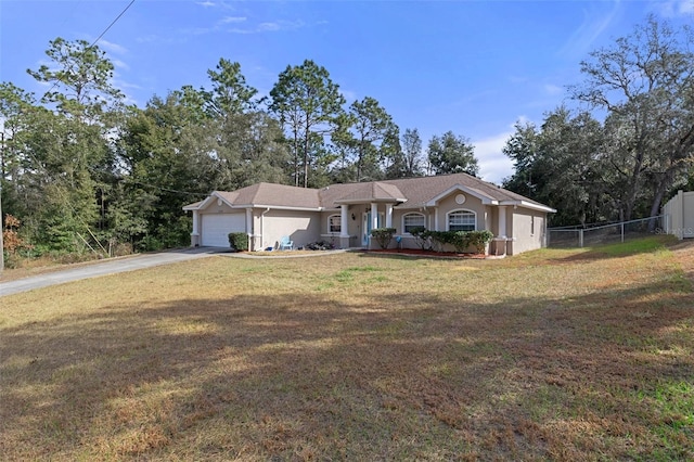 ranch-style house with a garage and a front yard