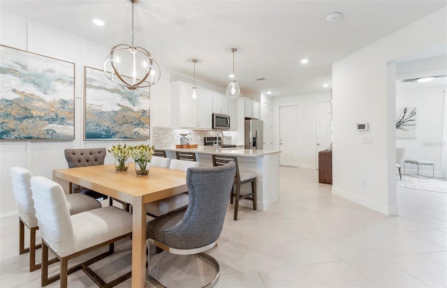 tiled dining room featuring a notable chandelier