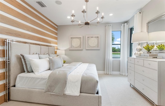 carpeted bedroom with a chandelier