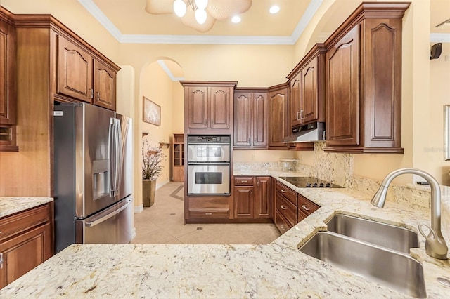 kitchen with light tile patterned flooring, appliances with stainless steel finishes, crown molding, and sink