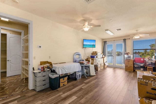 bedroom featuring ceiling fan, french doors, dark hardwood / wood-style flooring, lofted ceiling, and access to outside