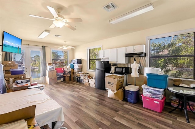 interior space featuring ceiling fan and french doors