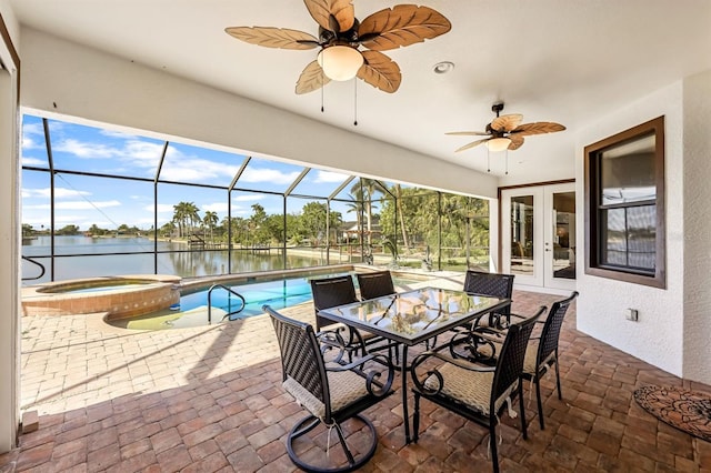 view of patio with french doors, a water view, a lanai, and a pool with hot tub