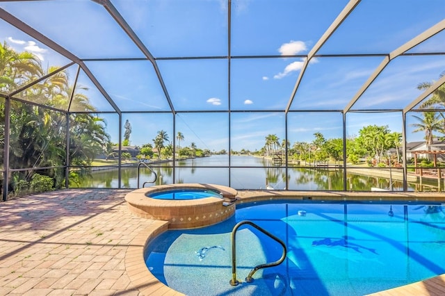 view of swimming pool featuring a lanai, a water view, and an in ground hot tub