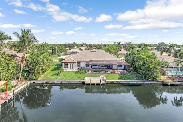 back of house featuring a lanai and a water view