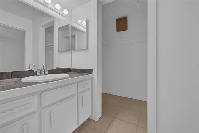 bathroom with tile patterned floors and vanity