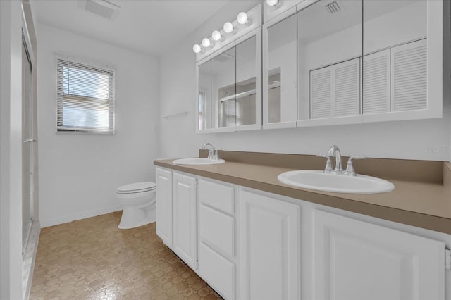 bathroom with toilet and vanity