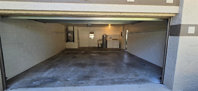 garage featuring washing machine and dryer