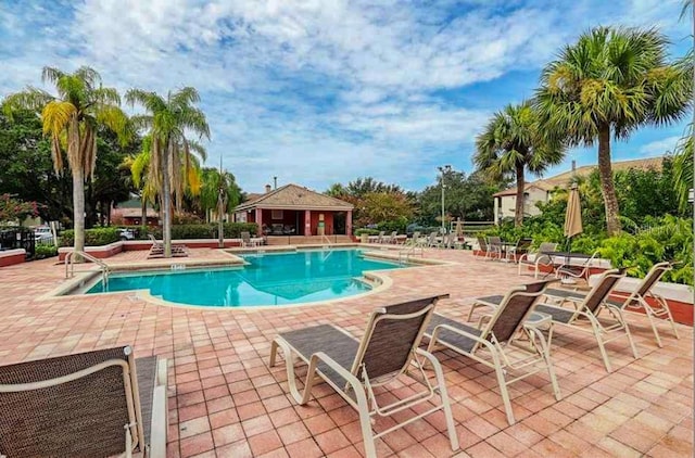 view of swimming pool with a patio area