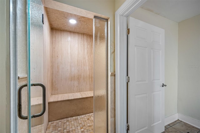 bathroom featuring tile patterned floors and an enclosed shower