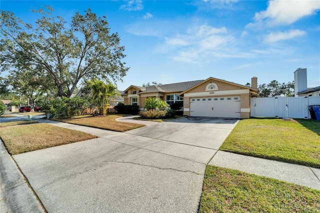 ranch-style home with a front yard and a garage