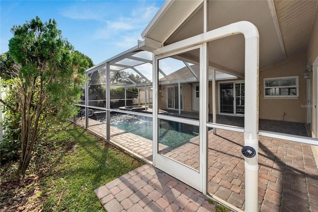 view of pool featuring a lanai and a patio