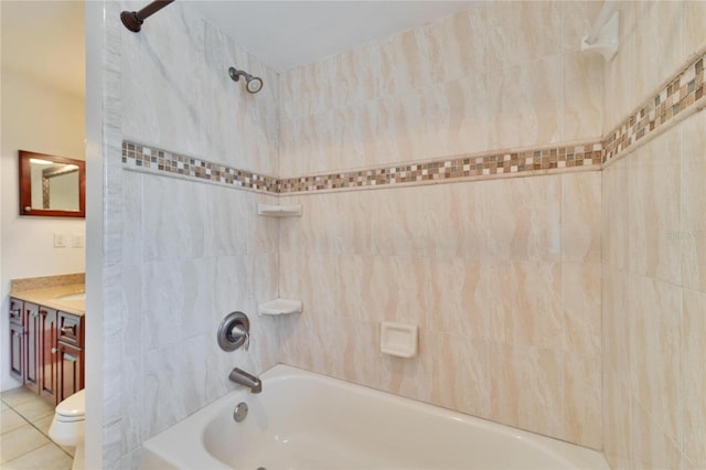 full bathroom featuring vanity, toilet, tiled shower / bath combo, and tile patterned flooring