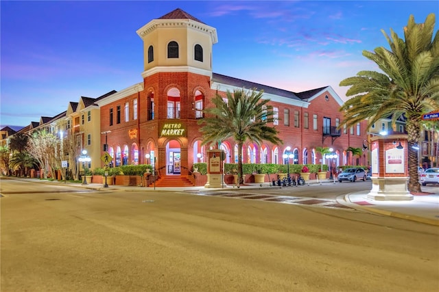 view of outdoor building at dusk