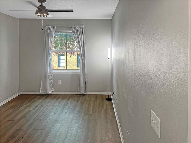 unfurnished room with ceiling fan and hardwood / wood-style floors