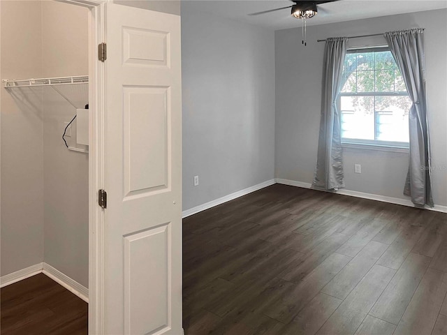 spare room featuring dark hardwood / wood-style floors and ceiling fan