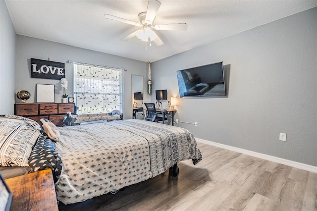 bedroom with ceiling fan and light hardwood / wood-style flooring