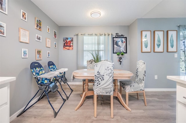 dining room featuring light hardwood / wood-style floors