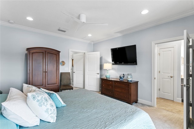 carpeted bedroom with ceiling fan and ornamental molding