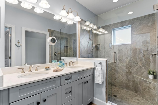 bathroom with vanity and a shower with shower door