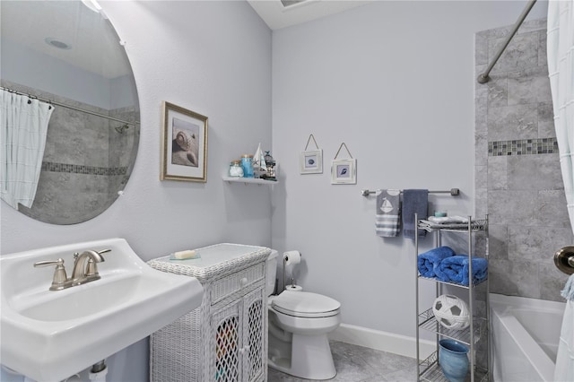 full bathroom with tile patterned floors, sink, shower / tub combo with curtain, and toilet