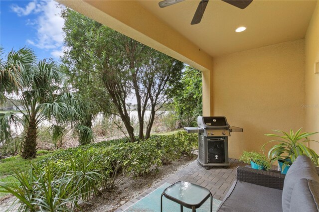 view of patio with ceiling fan and grilling area