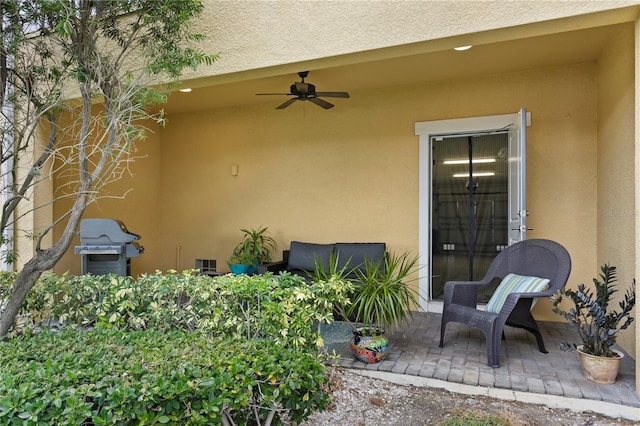 view of patio featuring area for grilling and ceiling fan