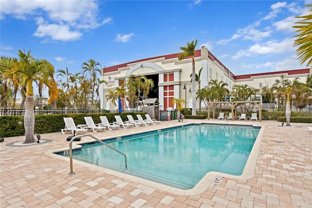 view of swimming pool with a patio