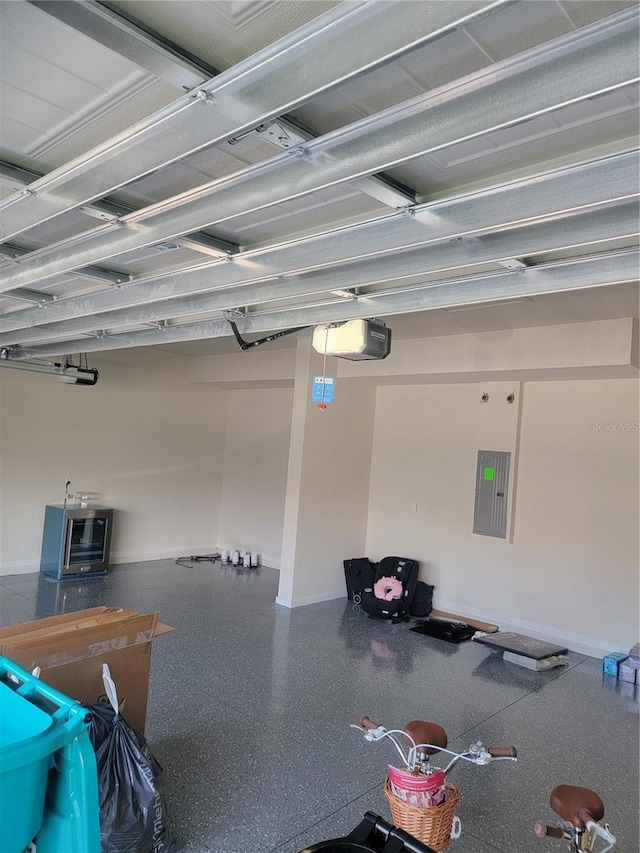 garage with a garage door opener and electric panel