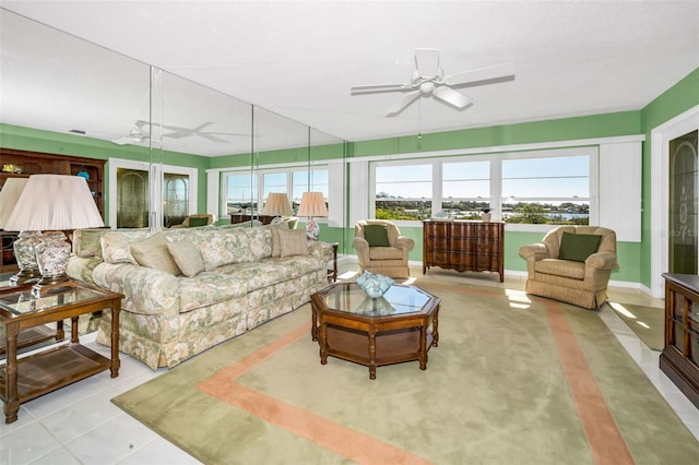 sunroom featuring a ceiling fan