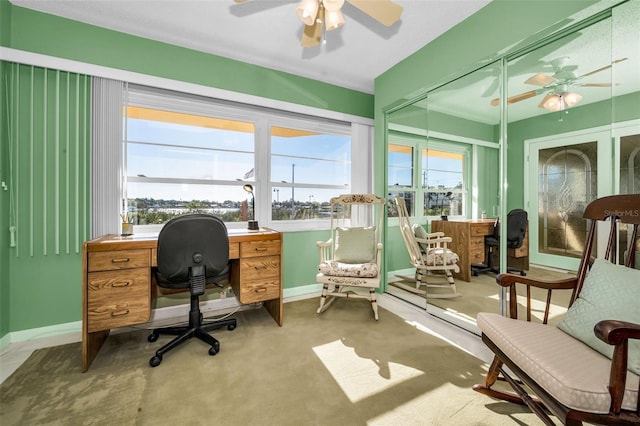 office with baseboards, a ceiling fan, and a wealth of natural light