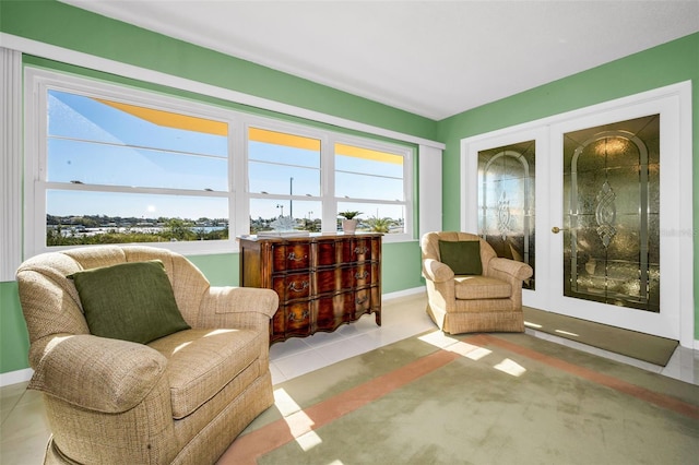 100 Bluff View Dr Unit 207C, Belleair Bluffs, FL 33770 - living area featuring french doors and baseboards